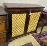 A mahogany chiffonier with two grill doors, width 109cm, depth 42cm, height 104cm                                                                                                                                           