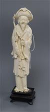 A carved ivory fisherman H.23cm including stand                                                                                        