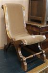 An early walnut Victorian nursing chair, with scrolling padded back and seat                                                           