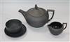 A black basalt teapot, a cream jug, a saucer and a bowl                                                                                