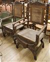 A pair of large French carved walnut elbow chairs                                                                                      