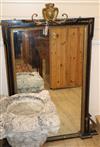 A 19th century parcel gilt ebonised wall mirror Height 124cm                                                                           