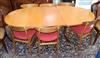 A mid century teak extending dining table and six chairs 206cm extended (one spare leaf)                                               