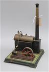 An early 20th century tinplate stationery engine with boiler and chimney, probably Bing                                                