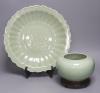 A Chinese circular celadon dish with scalloped rim, diameter 36cm, and a similar bowl, both with stands                                                                                                                     