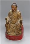 A carved wooden deity with polychrome and gilt decoration height 37cm                                                                  