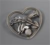 A George Jensen sterling leaping twin dolphin heart shaped brooch, no. 312, 41mm.                                                      