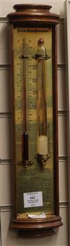 A modern 'storm glass' barometer in bow-fronted case H.46cm                                                                            