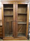 A pine faux bamboo and mesh two door cupboard W.132cm                                                                                  