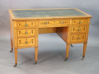 An Edwardian Edwards & Roberts marquetry inlaid satinwood kneehole desk, W.4ft D.2ft H.2ft 6in.                                        