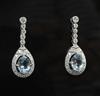 A modern pair of 18ct white gold, aquamarine and diamond set drop earrings, 28mm.                                                      