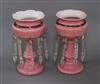 A pair of pink glass lustres height 26.5cm                                                                                             