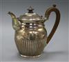 A George III demi fluted silver hot water pot, Robert Hennell II?, London 1810, gross 20 oz.                                           