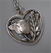 A Georg Jensen sterling 'robin and wheatsheaf' heart shaped pendant, no. 97, with chain, pendant 40mm.                                 