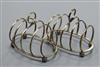 A pair of 1930's Asprey & Co silver five bar toast racks, Birmingham, 1937, 4 oz.                                                      