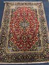 A Kashan blue and red ground carpet 200 x 138cm.                                                                                       