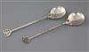 A pair of George V Arts & Crafts silver spoons, by the Keswick School of Industrial Art, 19.3cm.                                       