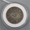 A Chinese silver coin                                                                                                                  