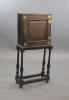 An early 18th century European japanned cabinet on stand, W.54cm D.24cm H.115.5cm                                                                                                                                           