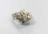 A white metal and three stone diamond ring with diamond cluster setting, size M, gross weight 4.4 grams.                                                                                                                    