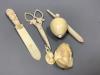 A group of early 19th/20th century ivory including a spinning top and a parasol needle case                                                                                                                                 