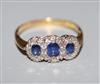 A modern 18ct gold, sapphire and diamond set triple cluster ring, size Z.                                                              