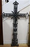 A cast iron black-painted crucifix of openwork foliate form length 104cm                                                               