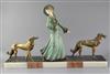 George Maxim (1895-1940). A French Art Deco painted and gilt spelter group of an elegant lady and two borzois, 26.5in.                 