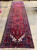 A North West Persian red ground hall carpet, 440 x 115cm                                                                                                                                                                    