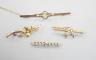 Three assorted 9ct and gem set bar brooches, including a swallow brooch, gross 5.9 grams and one other yellow metal and diamond chip set bar brooch, gross 1.7 grams.                                                       