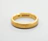 A 22ct gold wedding band, size O, 8.4 grams.                                                                                                                                                                                