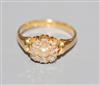 A late Victorian 18ct gold, rose cut diamond and split pearl set cluster ring, size O.                                                 