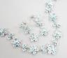 A modern 925 and blue zircon suite of jewellery, comprising a flower head cluster necklace and a pair of matching earrings.                                                                                                 