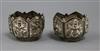 A pair of Indian? repousse white metal salts, 40mm.                                                                                    