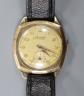 A gentleman's 1950's 9ct gold Accurist manual wind wrist watch, on associated leather strap, gross weight 29.7 grams.                                                                                                       