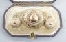 A Victorian yellow metal suite of jewellery, comprising a brooch and pair of earrings, brooch 34mm, gross 11.6 grams.                                                                                                       