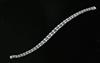 A 20th century 14ct white gold, graduated sapphire and diamond twin line bracelet, 18cm.                                               