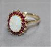 A 9ct gold, white opal and ruby oval cluster ring, size Q.                                                                             