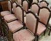 A set of ten Victorian oak red upholstered dining chairs                                                                               