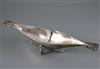 A George V Arts and Crafts Omar Ramsden planished silver two handled boat shaped dish, 9.5oz.                                          