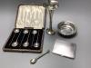 A silver cigarette case, coffee spoons, small bowl, vase and a small modern spoon by Guild of Handicrafts.                                                                                                                  