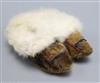 A pair of childs North American Indian seal skin and fur lined shoes/boots                                                             