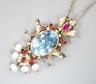 An Indian gilt metal, blue topaz, seed pearl, gem and enamel set hair ornament, 11.8cm.                                                                                                                                     