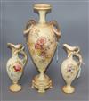 A Royal Worcester blush ivory amphora-shaped vase and a pair of similar Royal Bonn ewers, Vase H.47cm                                  