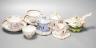 Three Chinese export famille rose tea bowls and two saucers, three Staffordshire porcelain cottage pastille burners and an English porcelain cream boat                                                                     