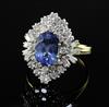 A modern 18ct gold, sapphire and diamond cluster ring, size S.                                                                         