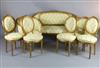 An early 20th century Louis XVI style carved and giltwood seven piece salon suite, settee 4ft 10in.                                    