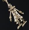 A 1960's 9ct gold and gem set pendant modelled as a clown, on a 9k gold round and elongated link chain, pendant 78mm.                  