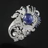 A modern ornate white gold and platinum, sapphire and diamond set clip brooch, 64mm.                                                   