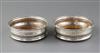 A pair of George III silver wine coasters by Soloman Hougham,                                                                          